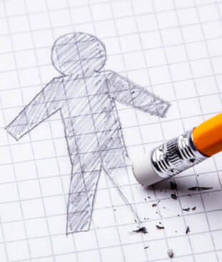 photo of shaded pencil drawing of simple body on paper with leg being erased by pencil
